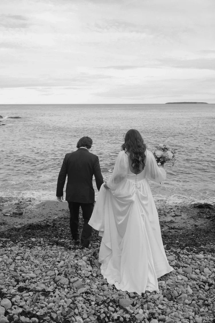 elopement couple at the rocky beach shores during their acadia national park elopement