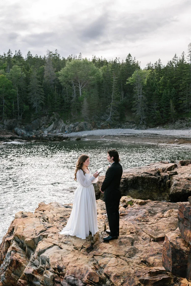 elopement couple exchanging private vows at little hunter's beach