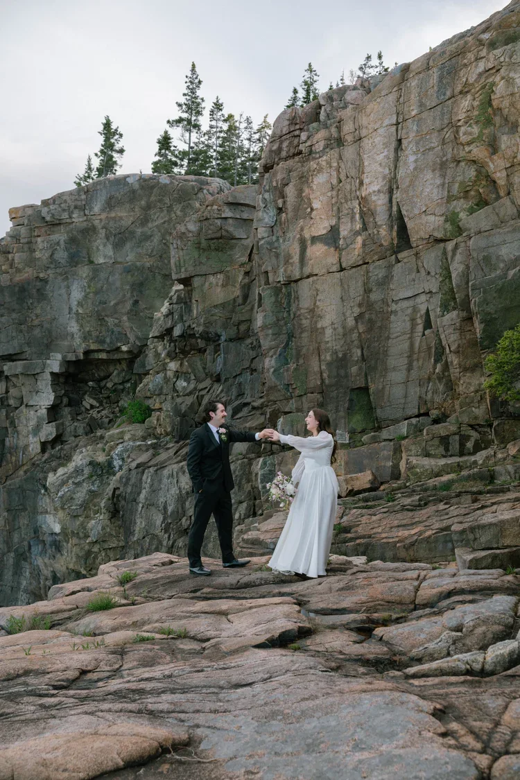 candid bride and groom moments during their elopement at otter cliff overlook in acadia