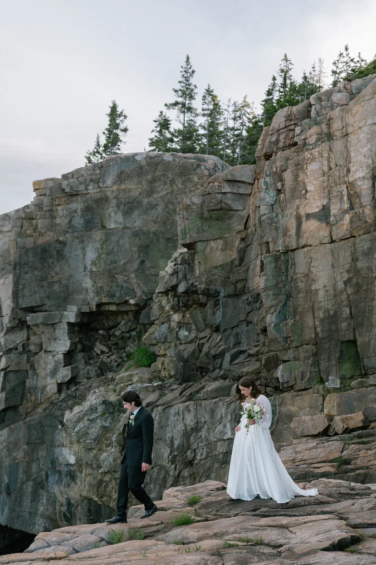 candid bride and groom moments during their elopement at otter cliff overlook in acadia