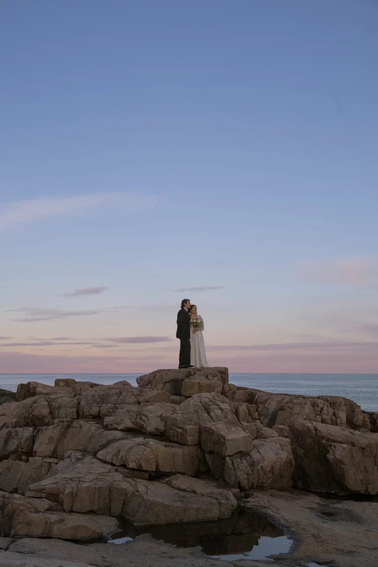 elopement couple at otter point during sunset