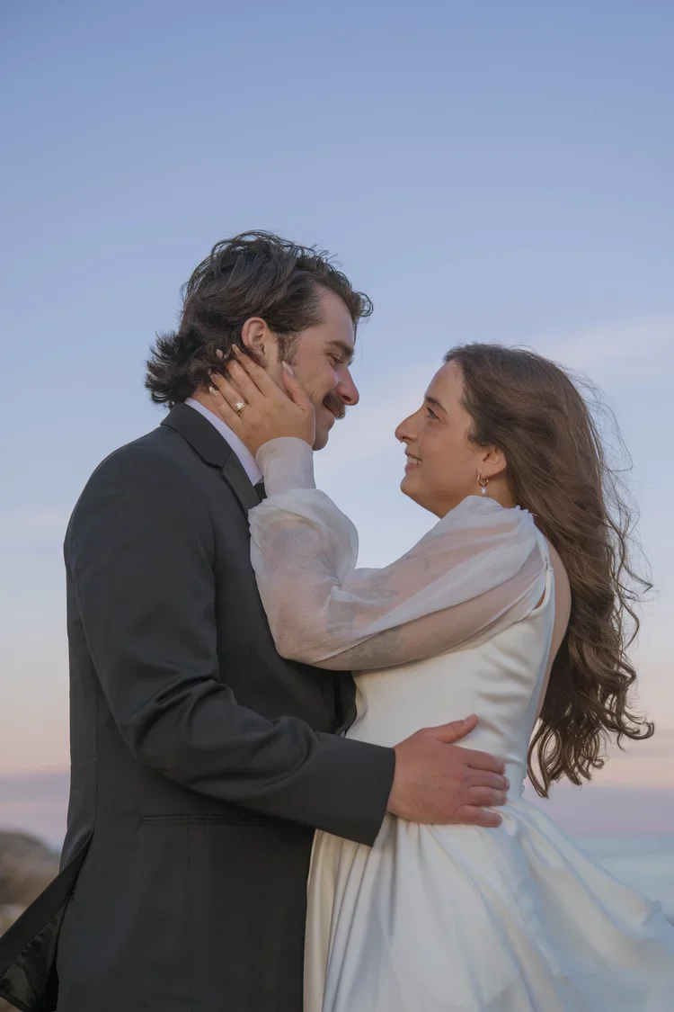 elopement couple at otter point during sunset