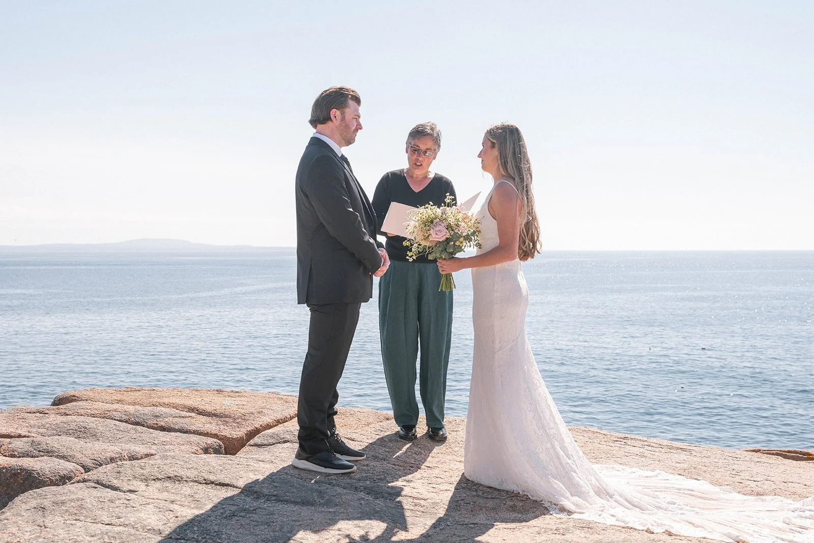 summer elopement ceremony at monument cove