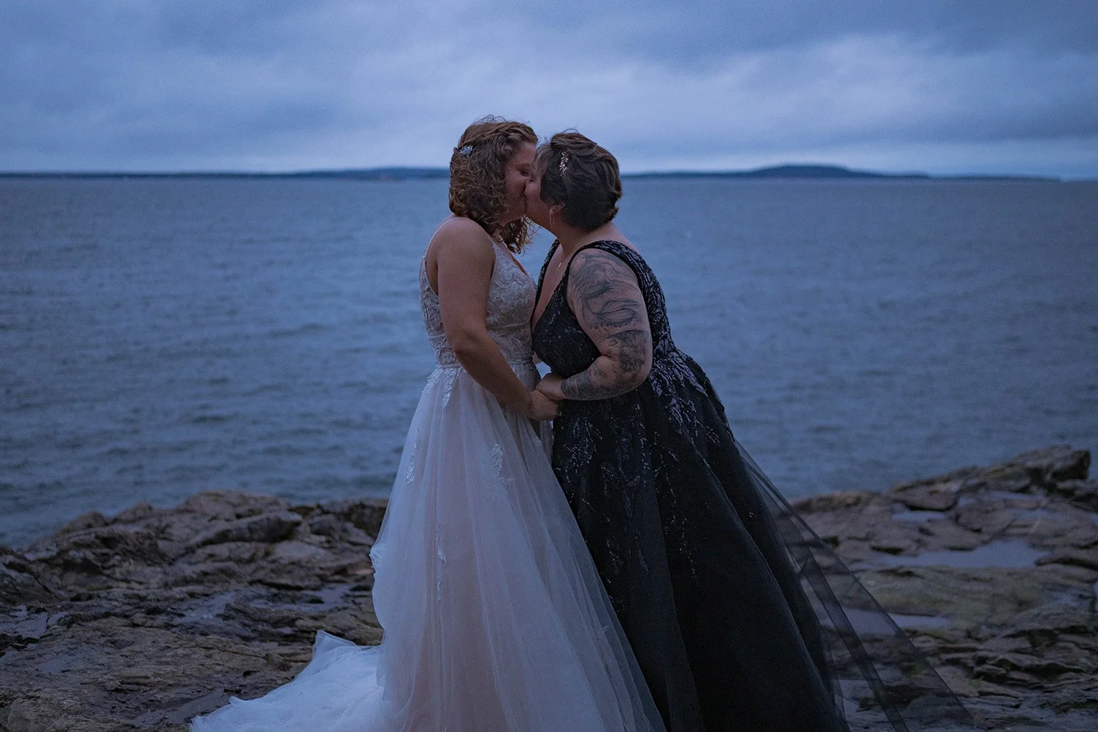 moody lgbtq coastal elopement in acadia national park during sunrise