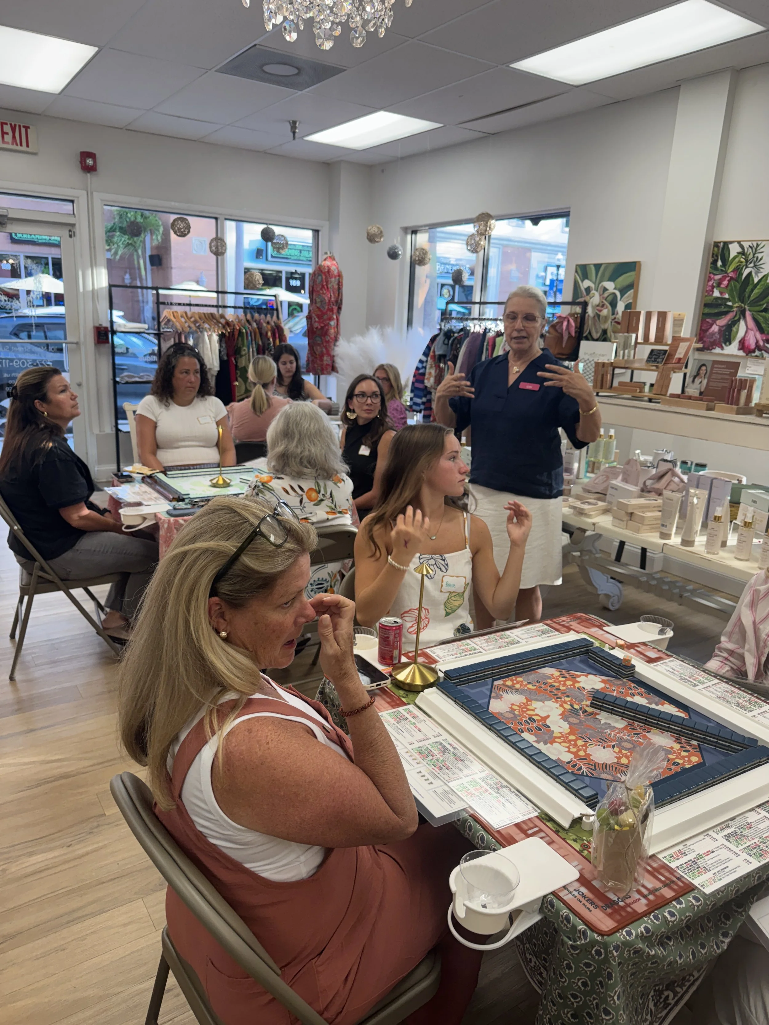 Gaia Banovich teaching a beginner American Mahjong class to a group of women in Pinellas County.