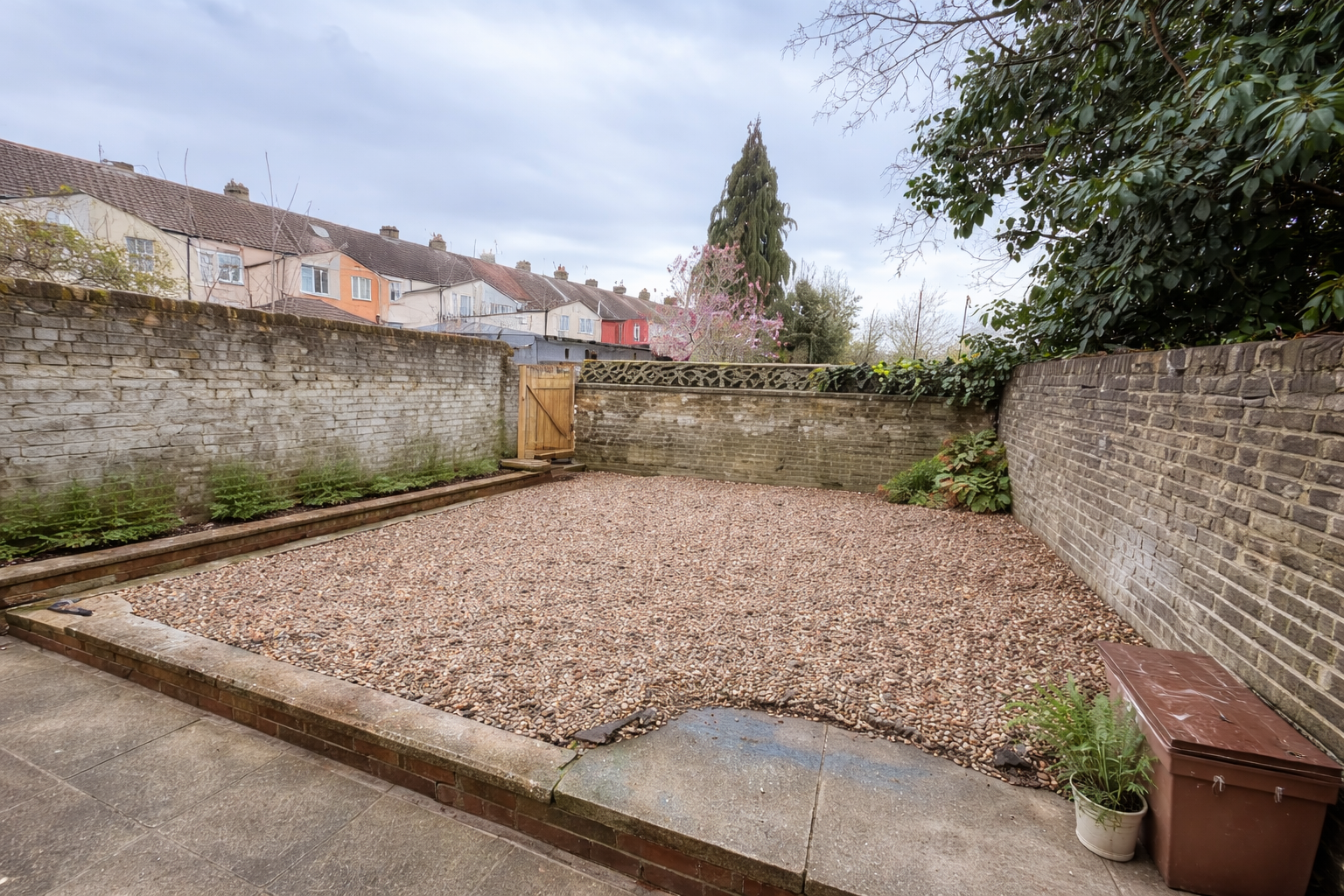 Serene backyard with gravel garden.png