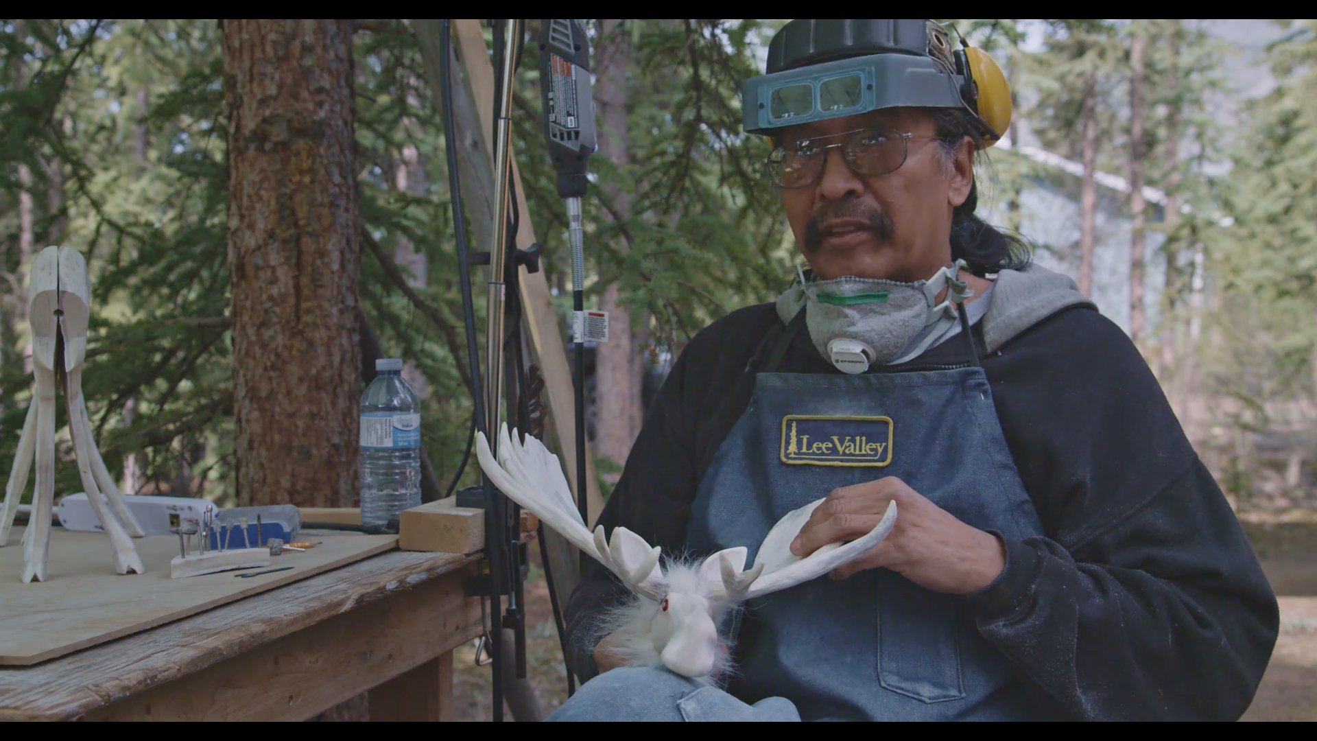 Journeys to Adaka Dennis Shorty carving.jpg