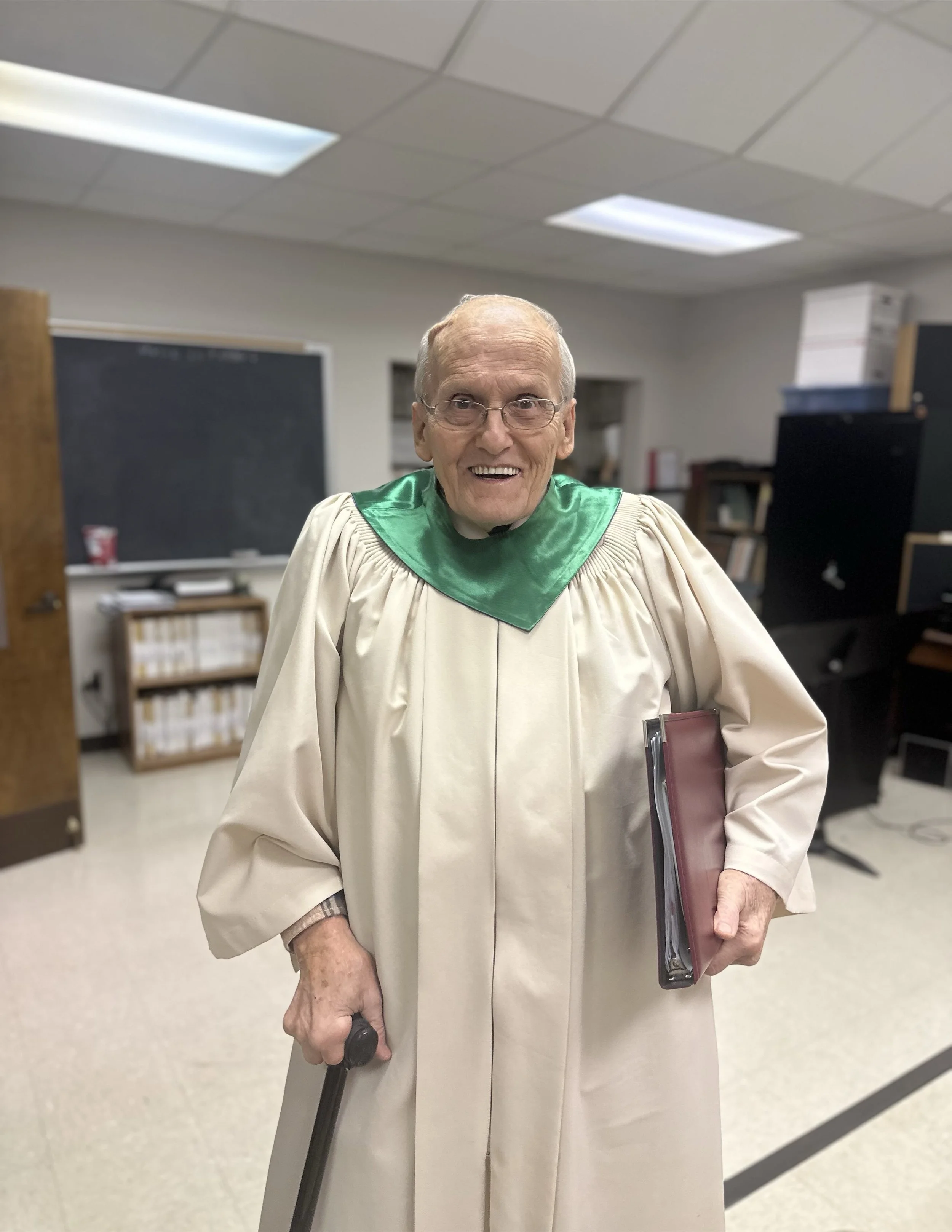 Tenor Singer standing in choir robe
