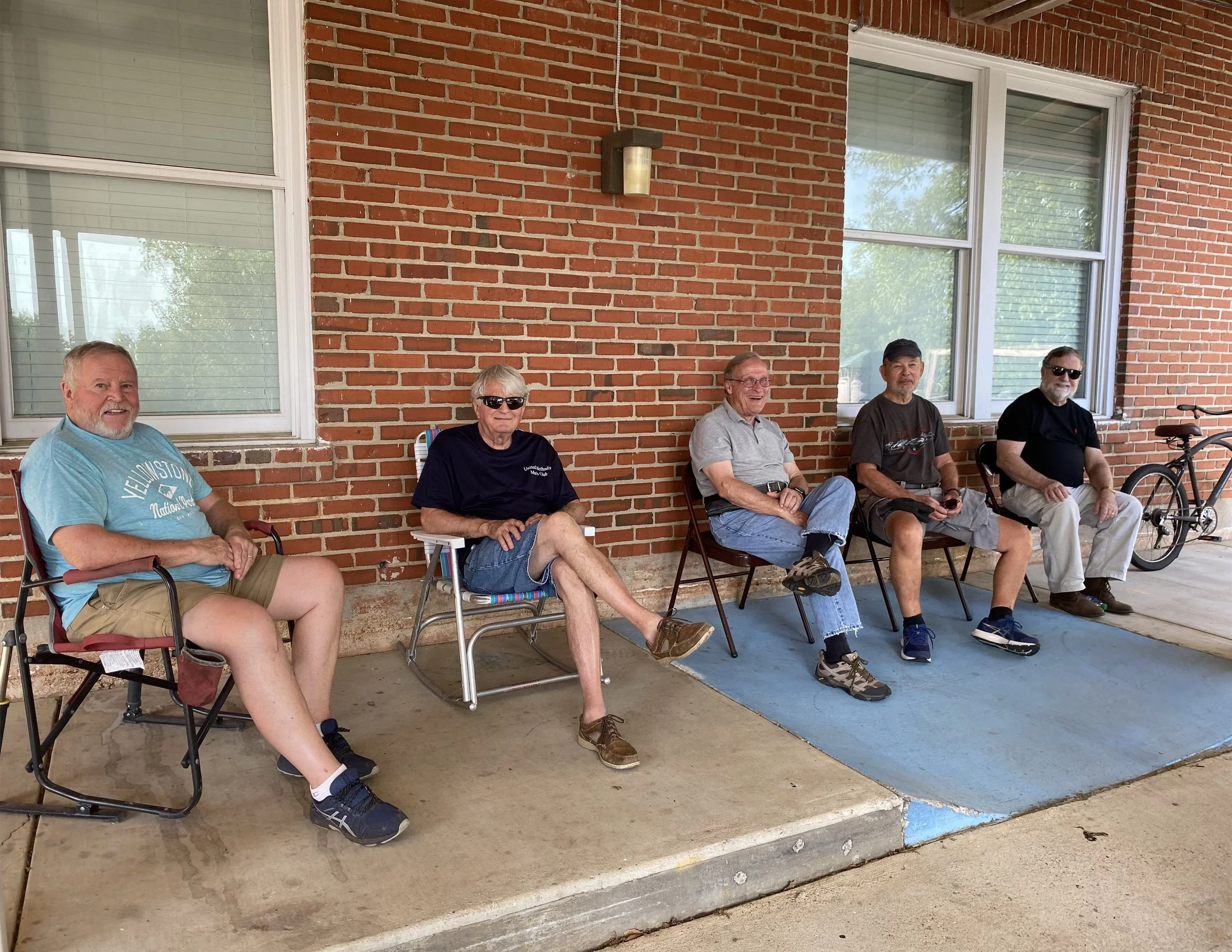 United Methodist Men sitting in lawn chairs