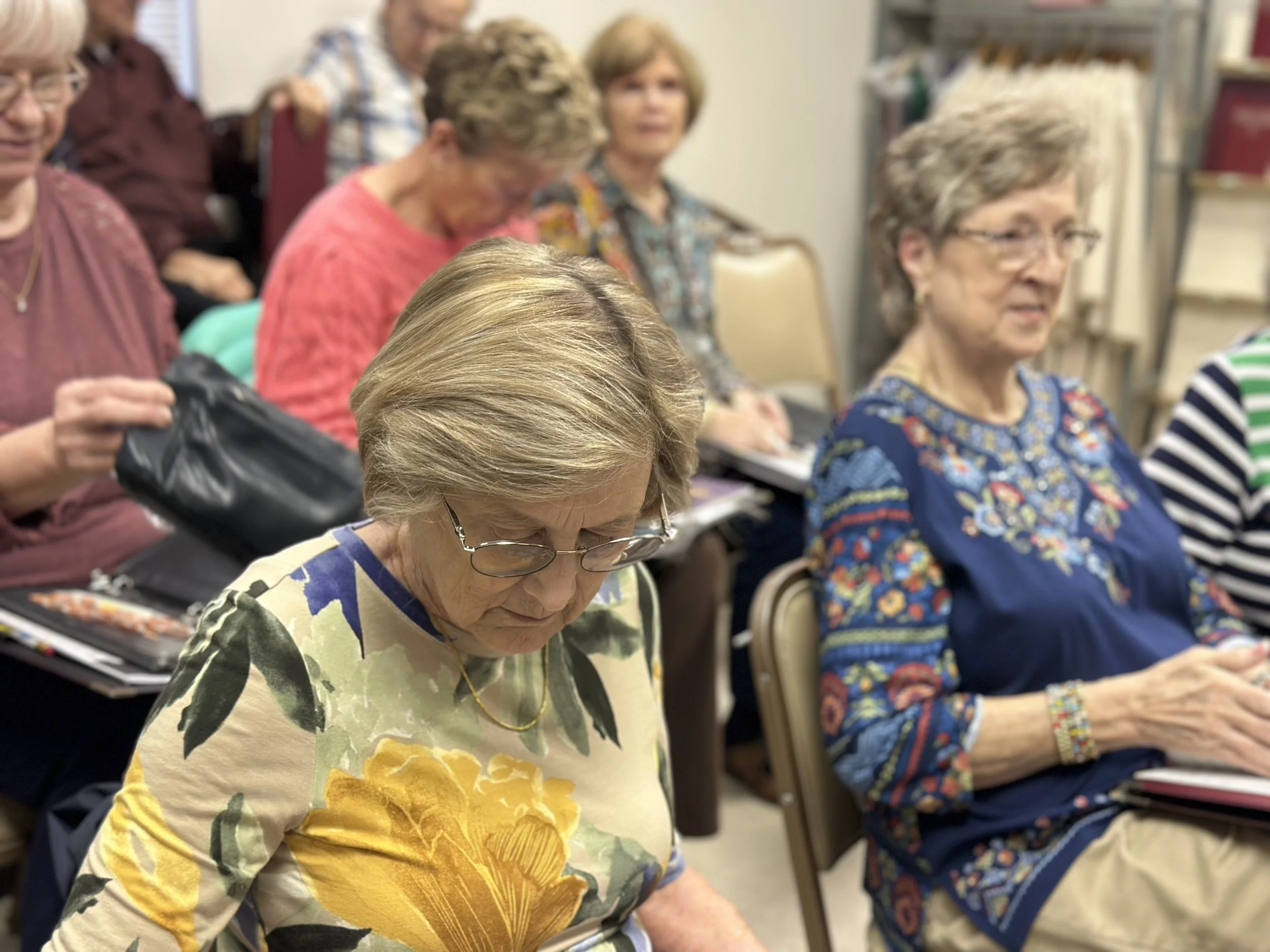 women seated in a meeting