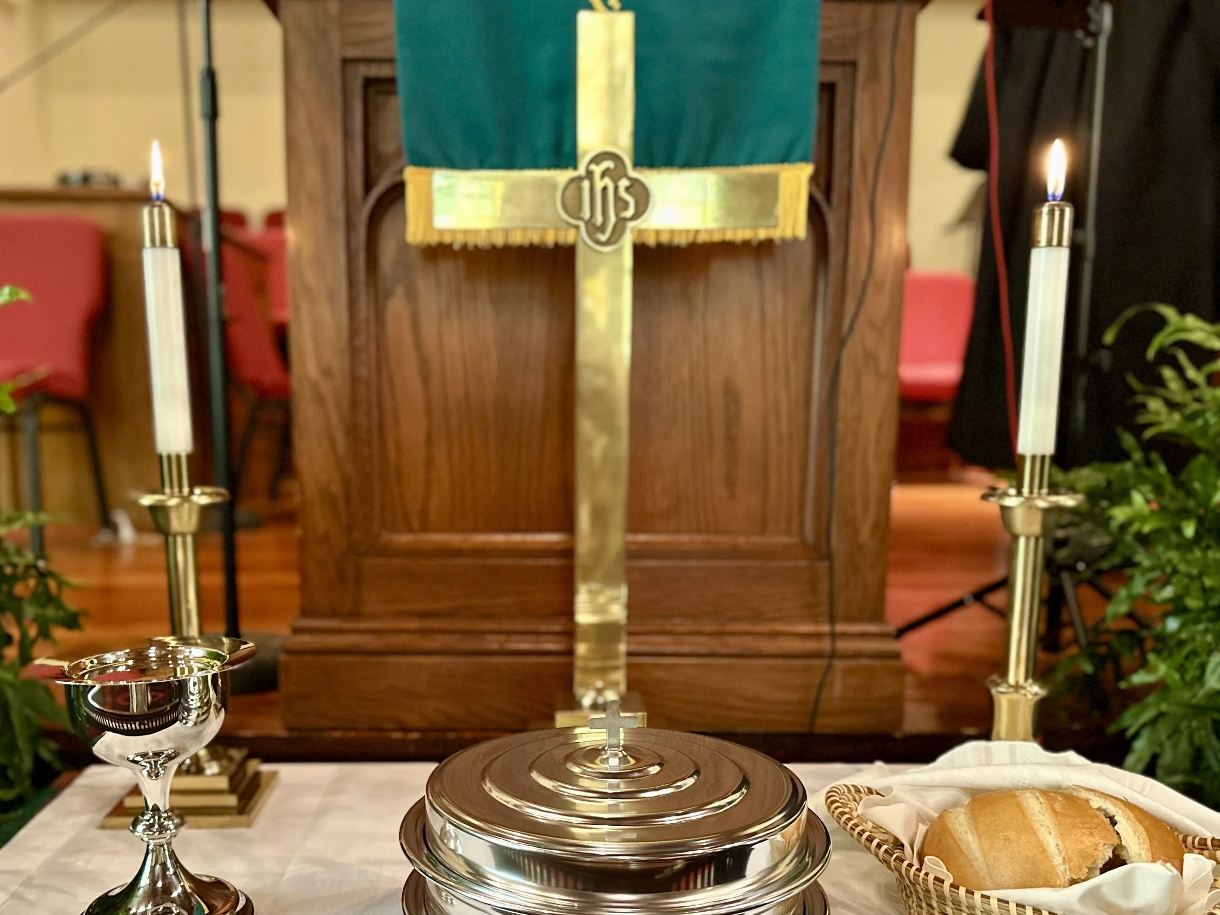Communion table set with gold cross at center