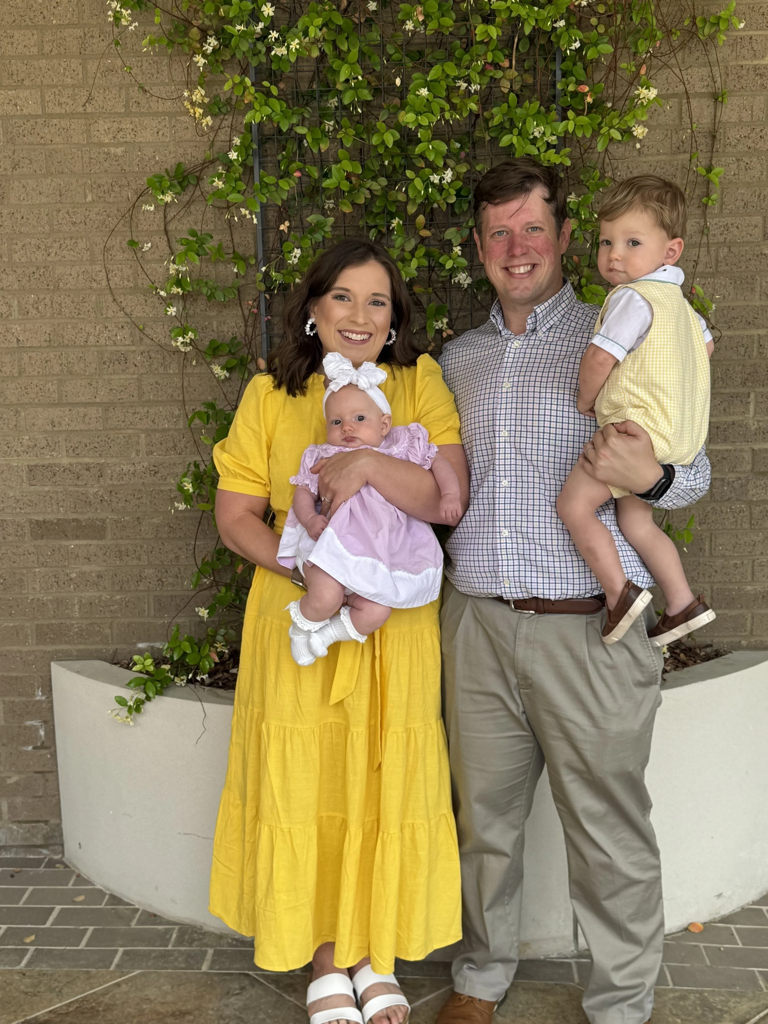 Pastor Reid Turner stands with wife Alyssa and their two children