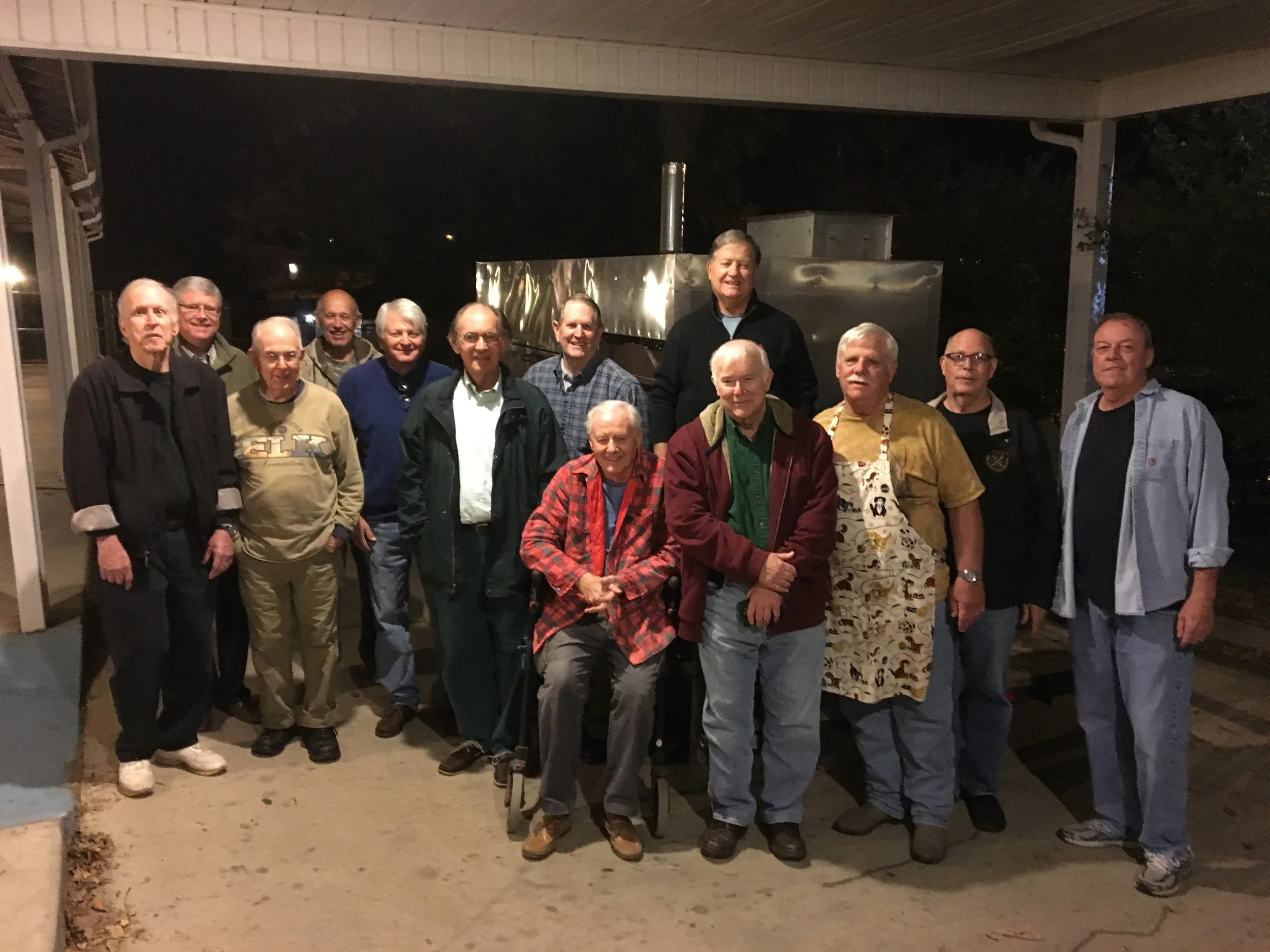 United Methodist Mens Group standing with their smoker