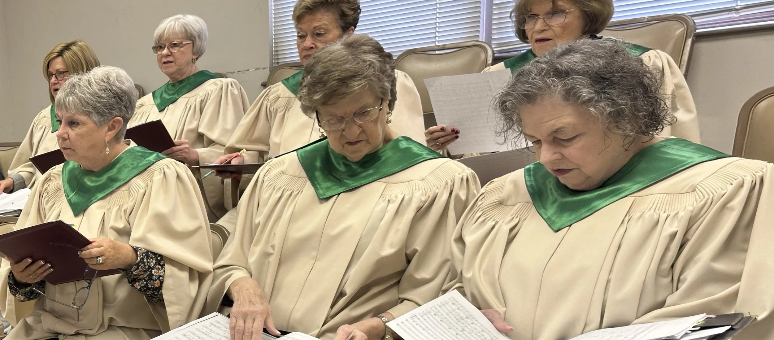 Choir Members at rehearsal and in robe