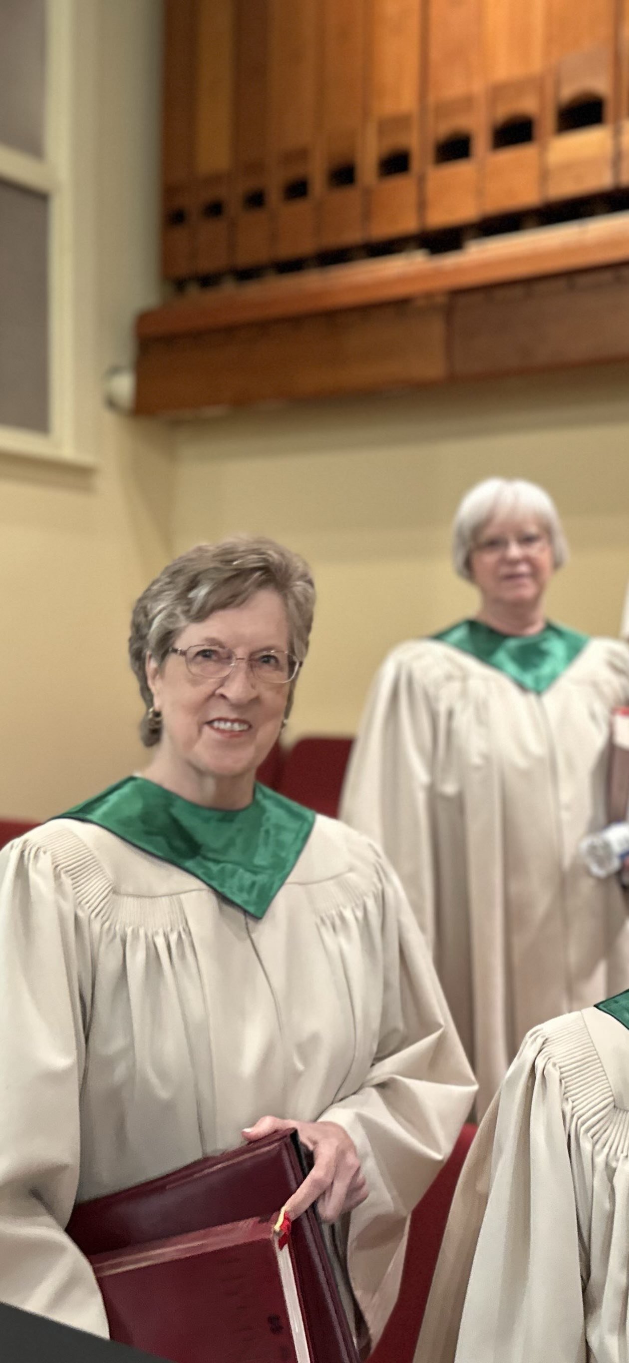 Choir members smiling for the camera