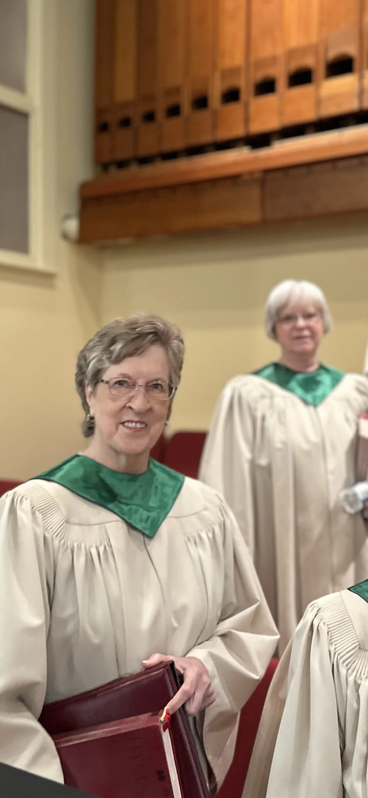 Choir members smiling for the camera