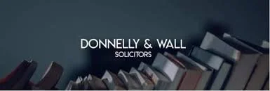 Logo for Donnelly & Wall Solicitors with a background of falling books.