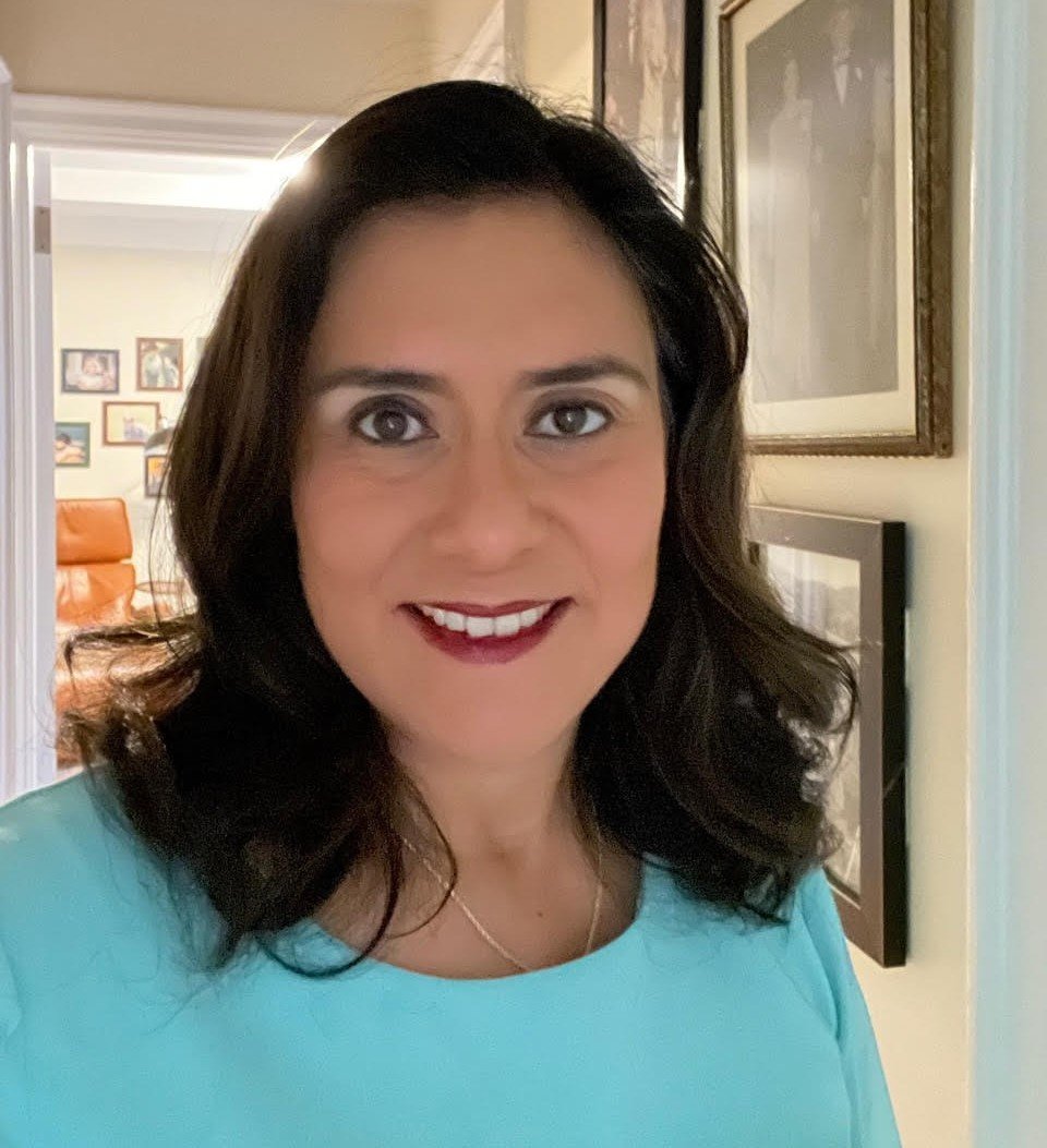 A past life regression and Life Between Lives hypnotherapy client of Jennifer Catlin's with a blue shirt on