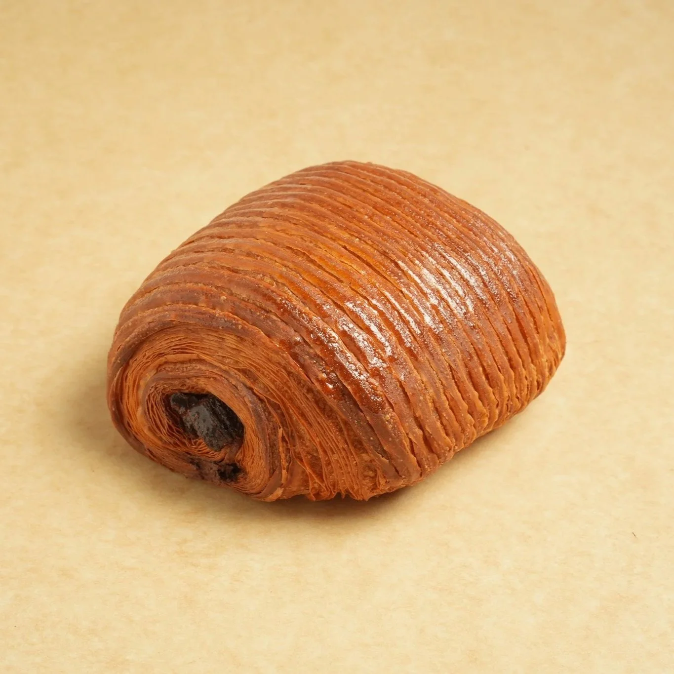 45º angle of a chocolate croissant pastry.