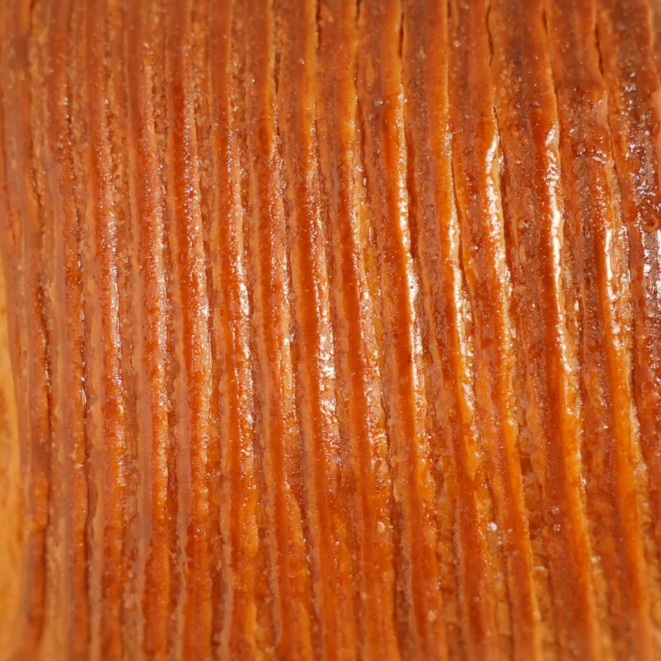 Close-up of the top of a croissant.
