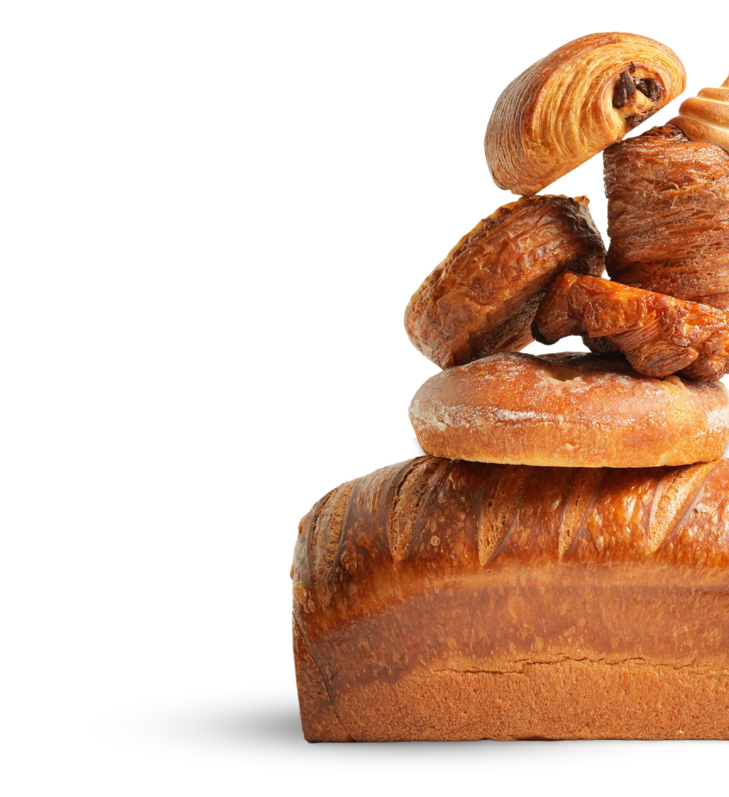 A stack of various baked goods including a loaf of bread, croissant, cinnamon roll, sticky bun, and other pastries against a black background.