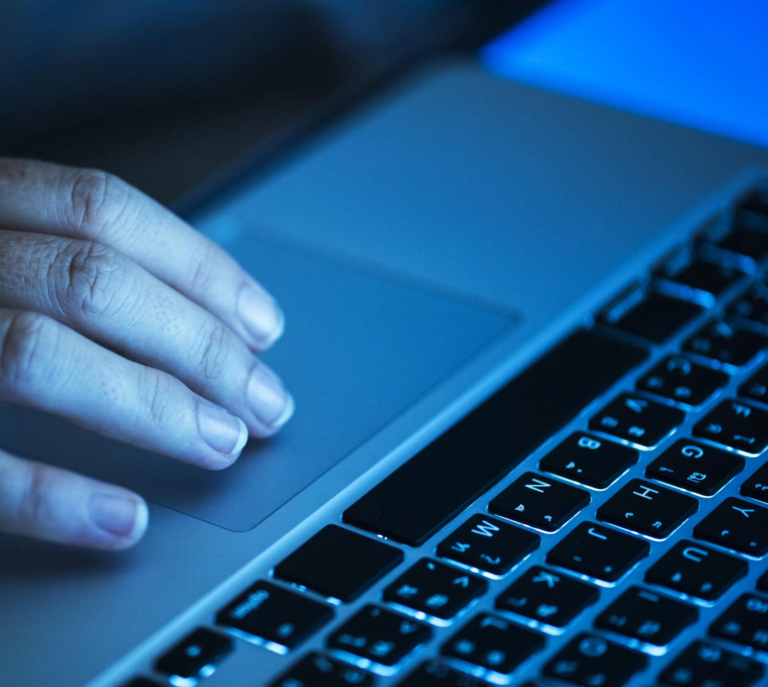 Blue hued hands on keyboard - Screening Tools - ePsychologists - Alcohol and drug rehab - confidential online psychology - non-judgemental alcohol and drug therapy - is my alcohol use high - is my drug use bad
