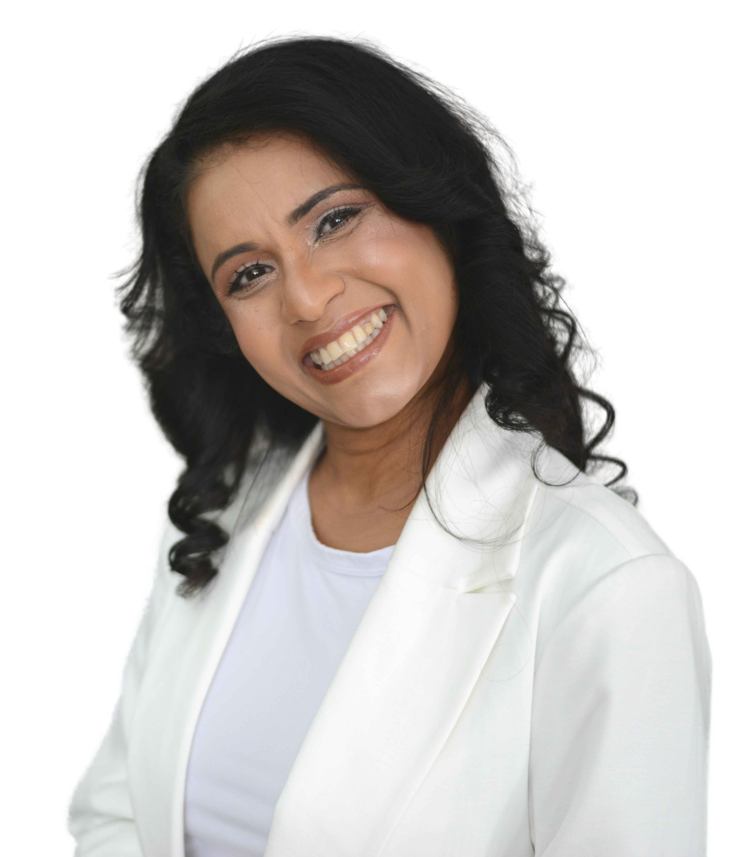 A woman with dark hair styled in loose curls, smiling at the camera, wearing a white blazer and shirt, against a black background.