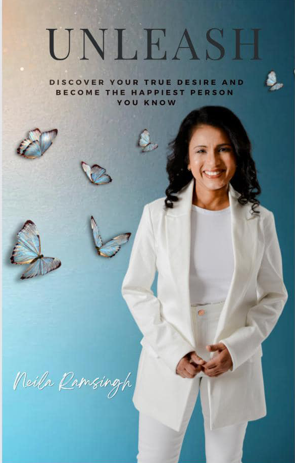 Book cover titled 'Unleash' featuring a smiling woman in a white suit and blue background with butterfly illustrations, author's name Neila Ramsingh.