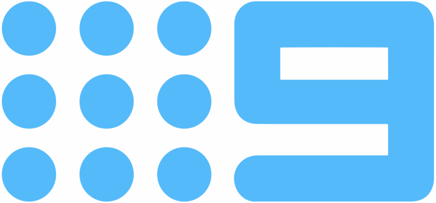 Close-up of a blue calculator with round buttons and a rectangular display screen.