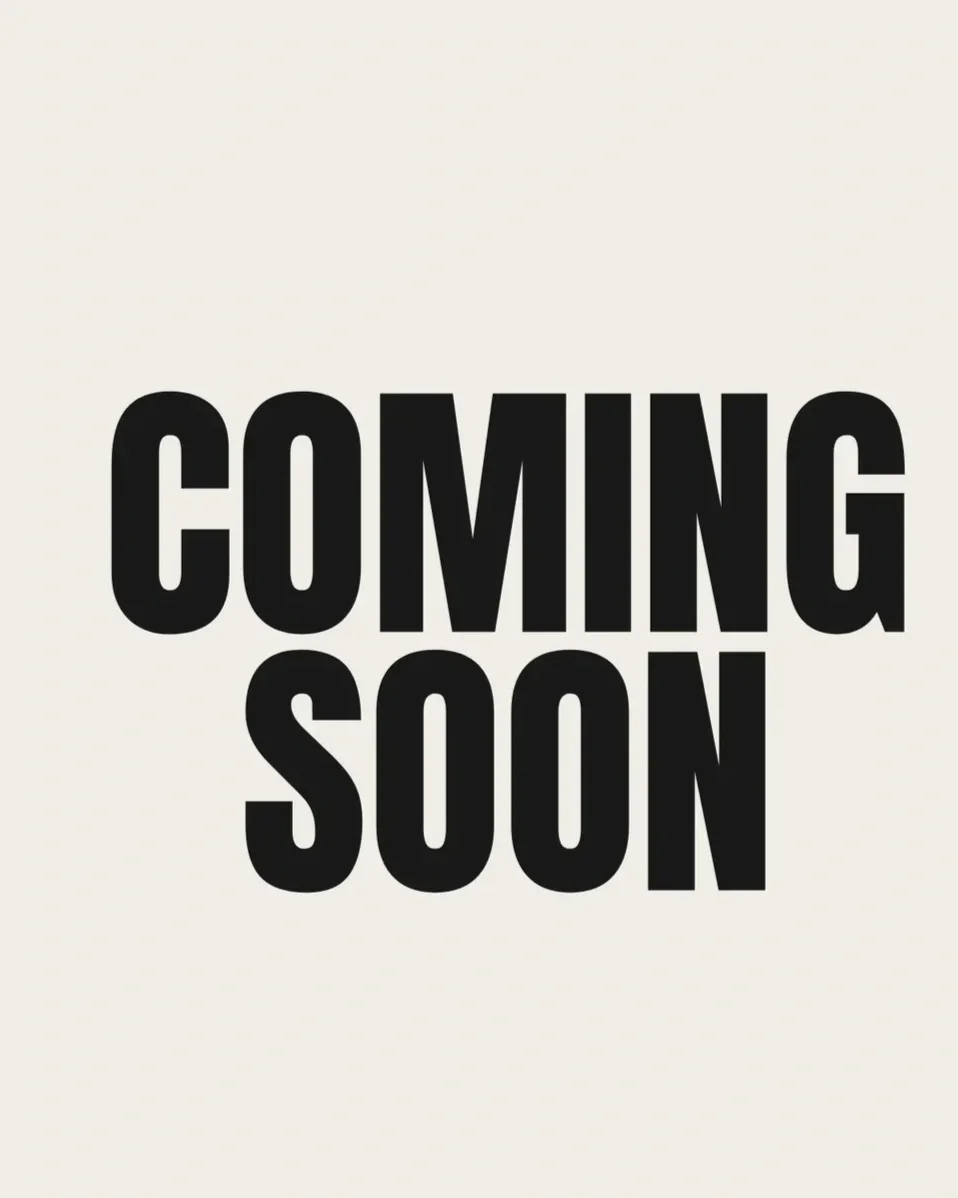 Text that reads 'COMING SOON' in large black letters on a light background.
