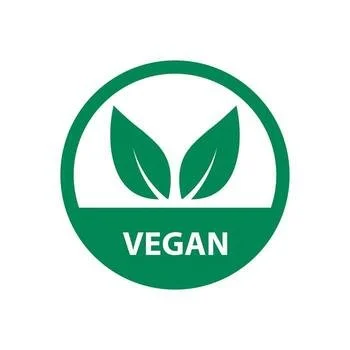 A circular logo with a green outline and background, featuring two leaf illustrations and the word 'VEGAN' in white text.