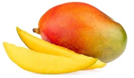 Fresh mango with one sliced piece in front