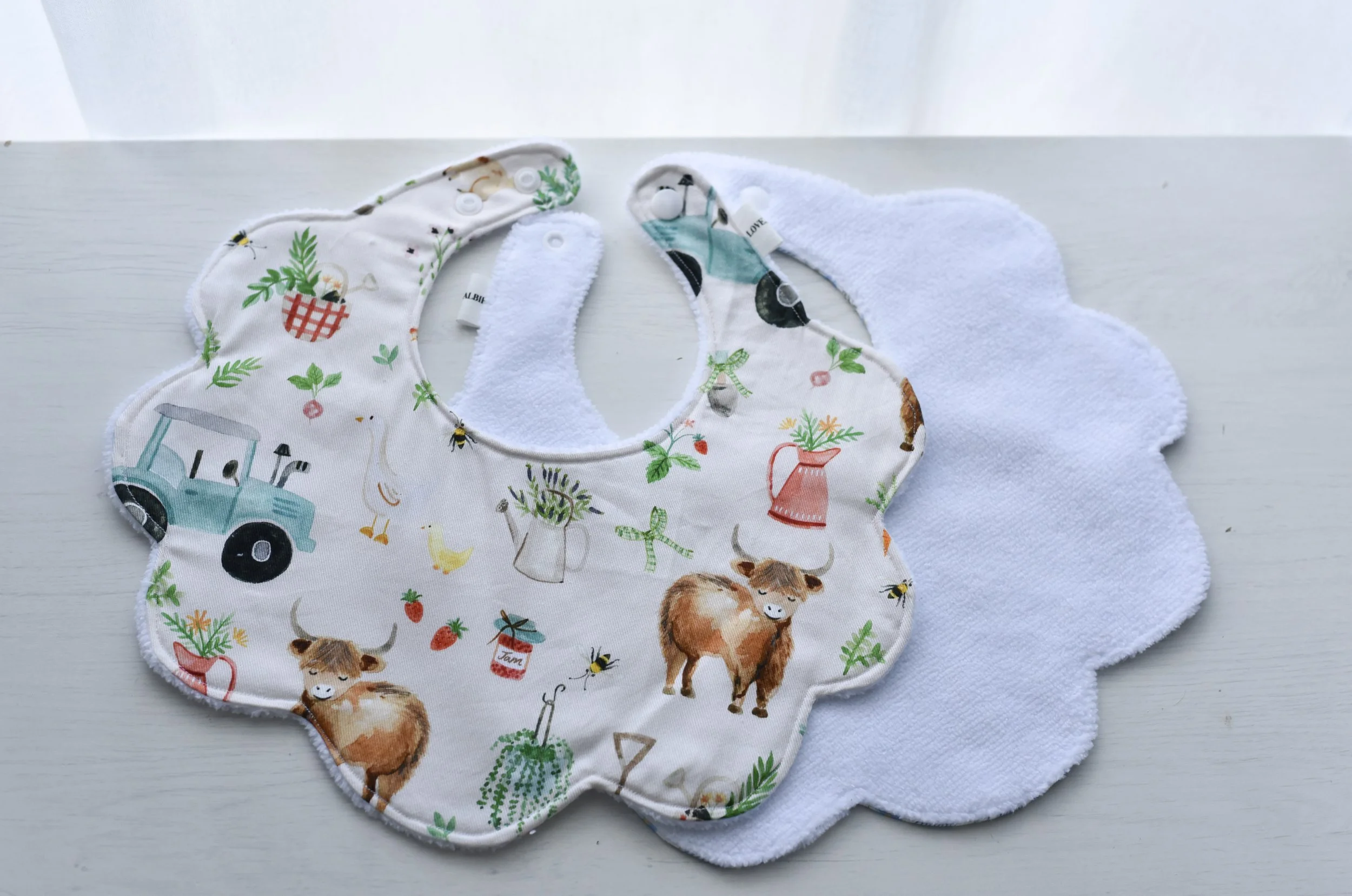 Meadow Moo Bib