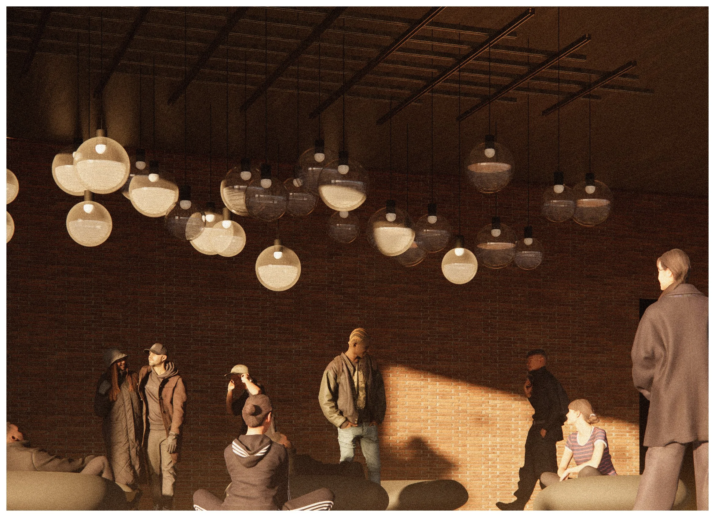 People gathered in a modern room with a brick wall and hanging spherical pendant lights. Some individuals are standing, sitting, or engaged in conversation, with sunlight casting shadows on the wall.