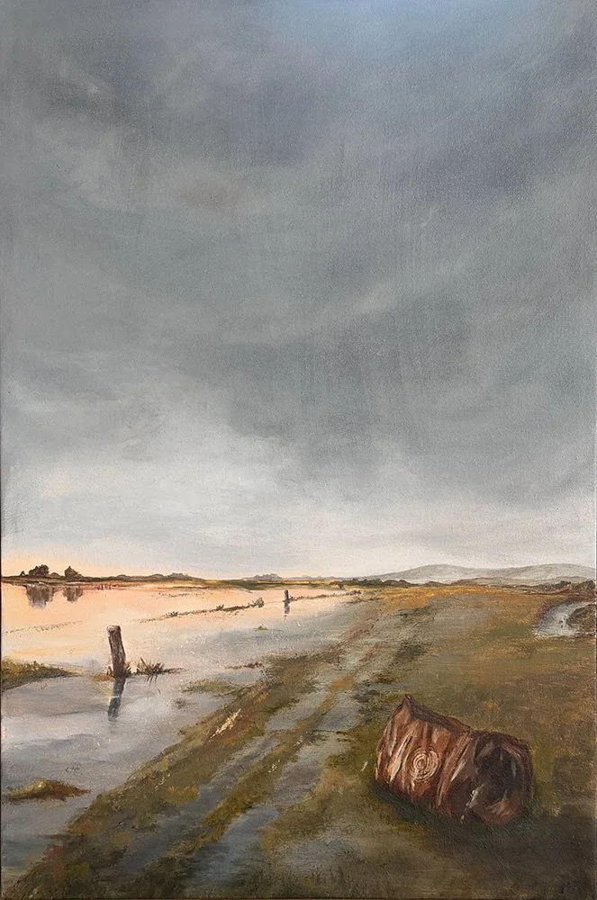 Oil panning of a flooded North Canterbury paddock with fence posts, a muddy track and a bag in the foreground