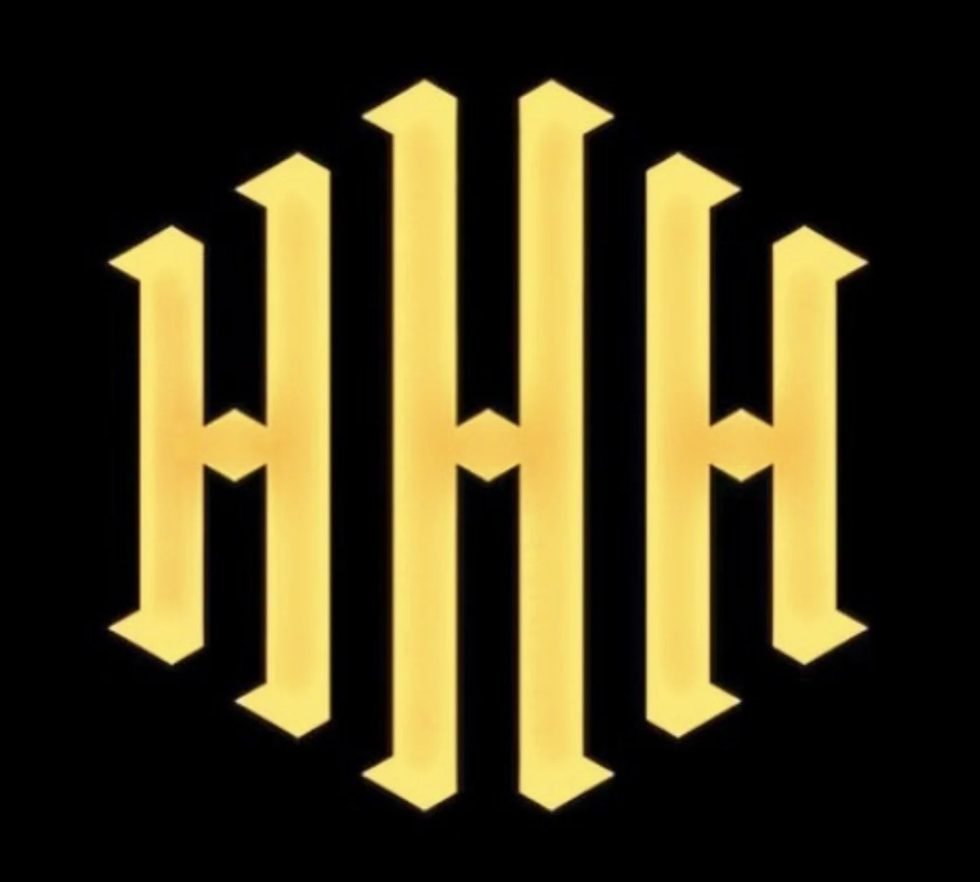 The Warner Bros logo with a stylized, yellow, winged emblem on a black background.