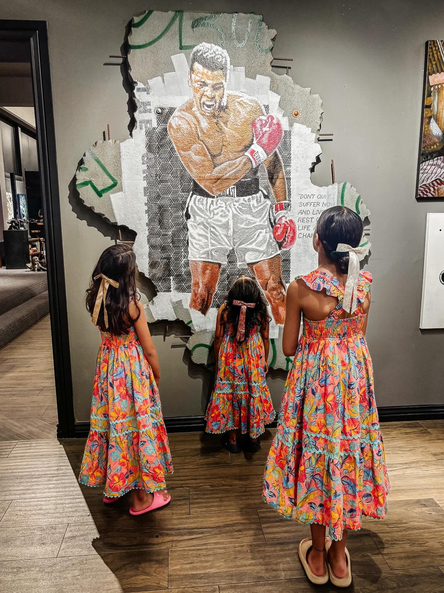 Striking Art Piece.

While wandering downtown Palm Springs during the art walk, we stopped in front of this powerful art piece of Muhammad Ali - mid-growl, boxing gloves on, pure determination frozen in time.

My oldest had just finished the Ali book