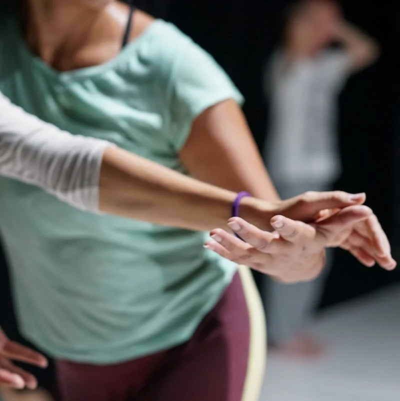 Hands of two women touching lightly