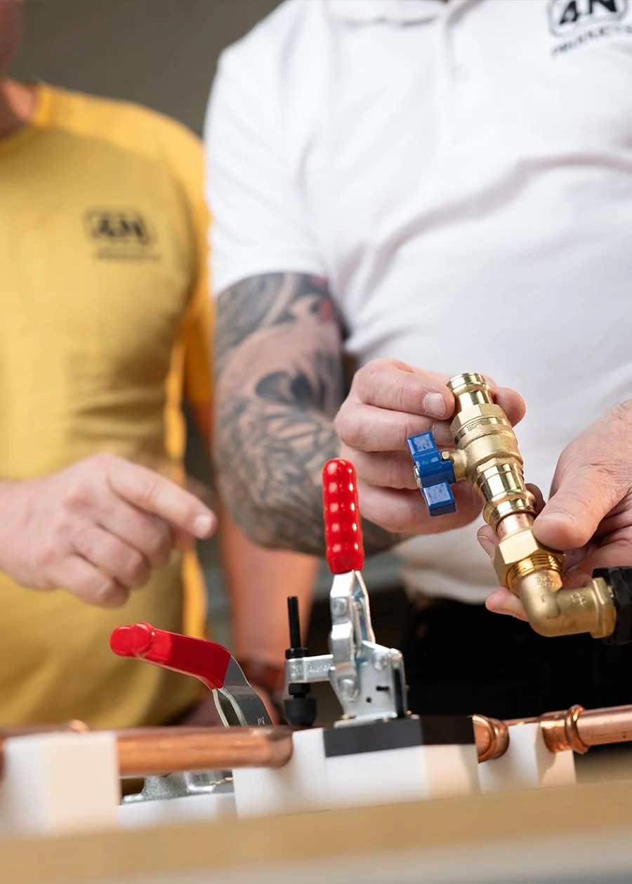 Two men inspecting Cloudtap unit pieces