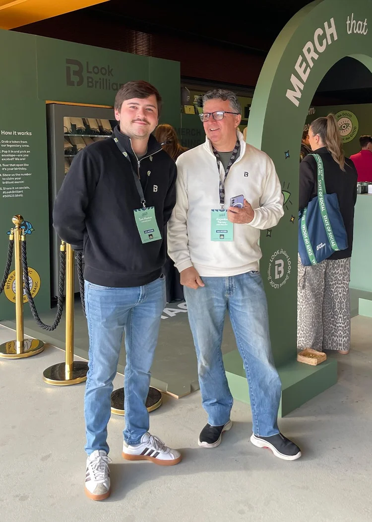 Two Look Brilliant employees standing beside activation at State of Social