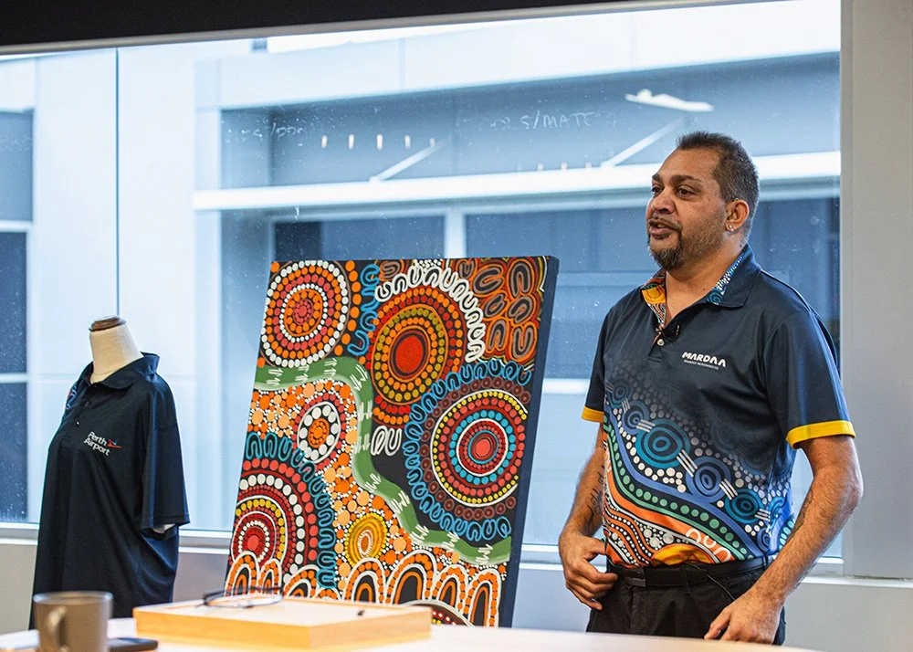 A Mardaa employee presenting work to clients