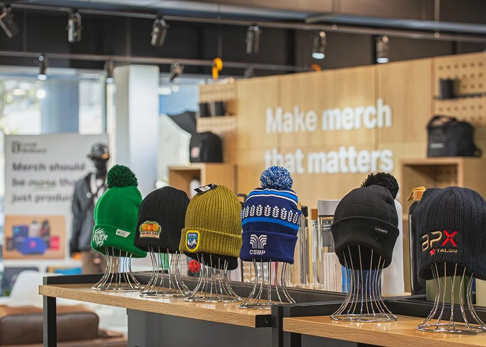 A range of headwear items arranged in a showroom