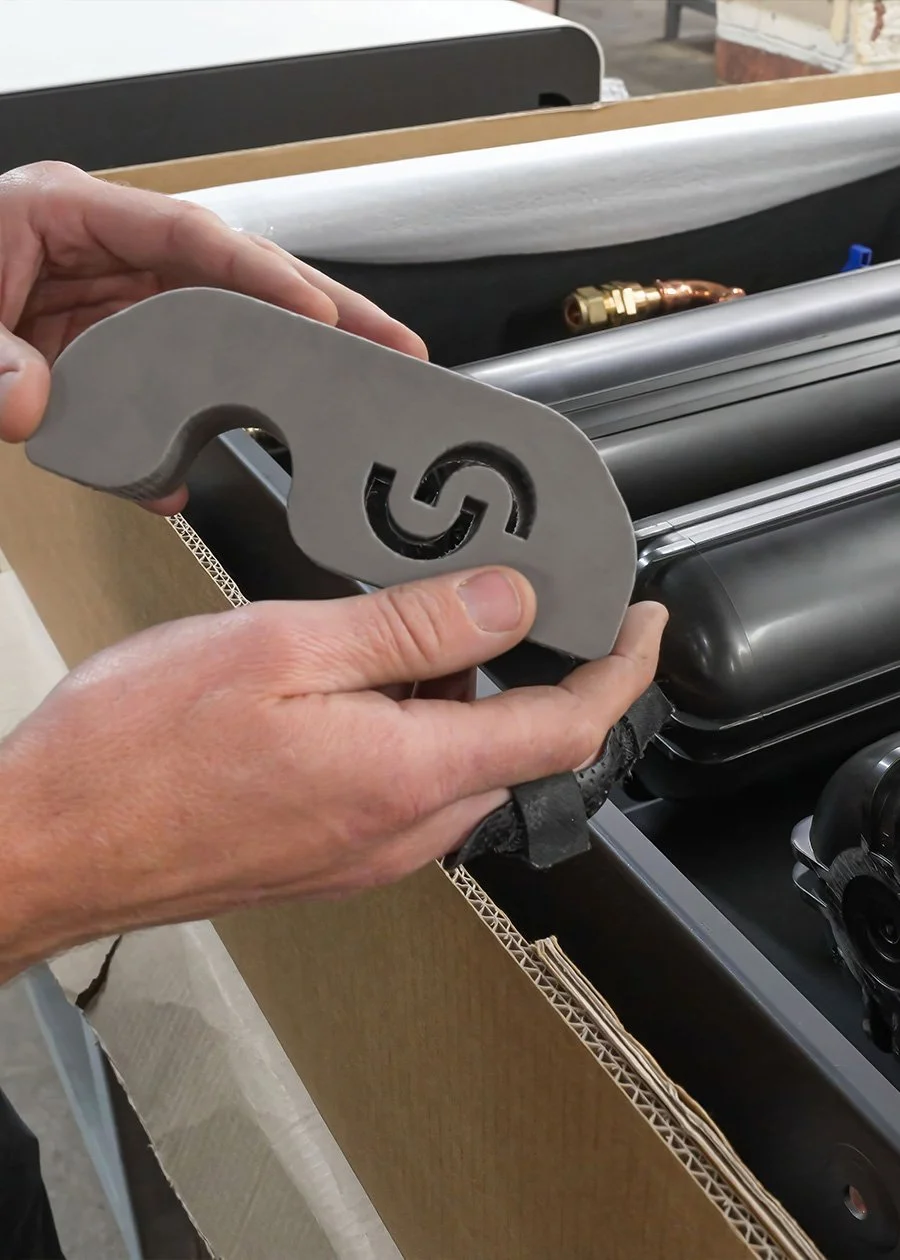 Man inspecting piece for Cloudtap unit