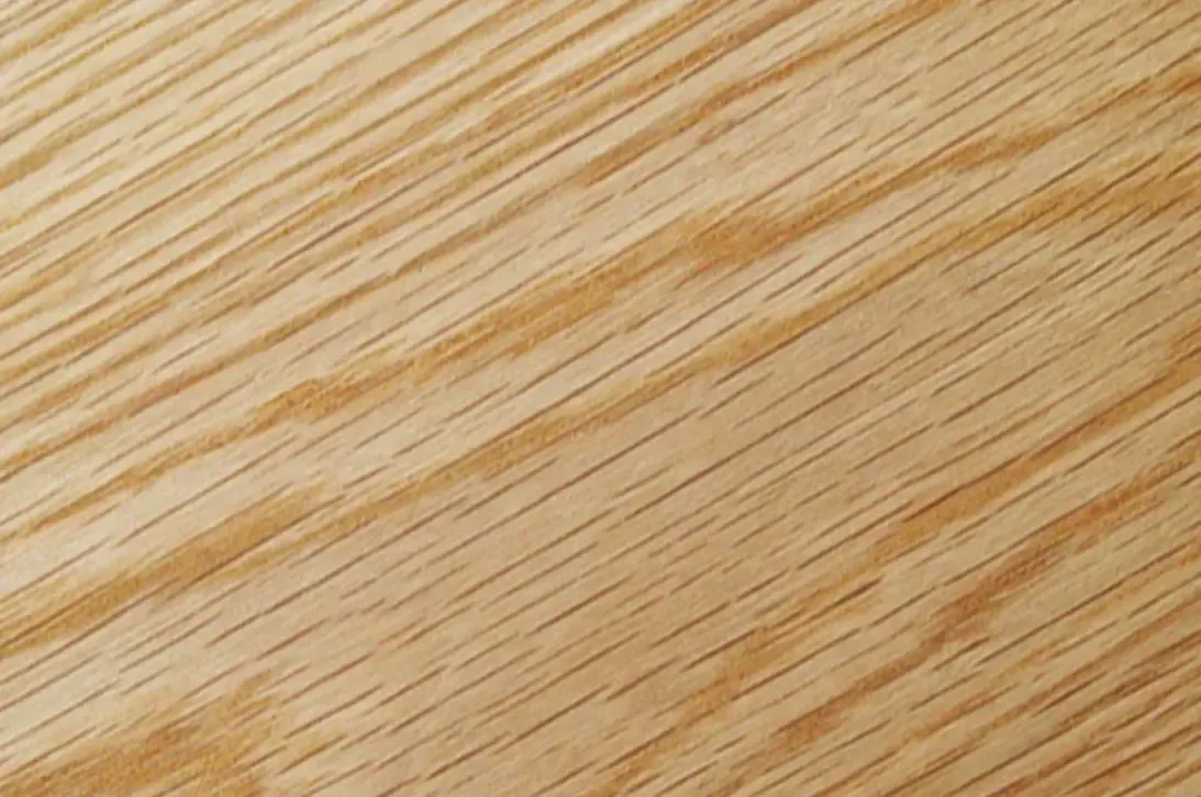 Close-up of a wooden surface with visible wood grain.
