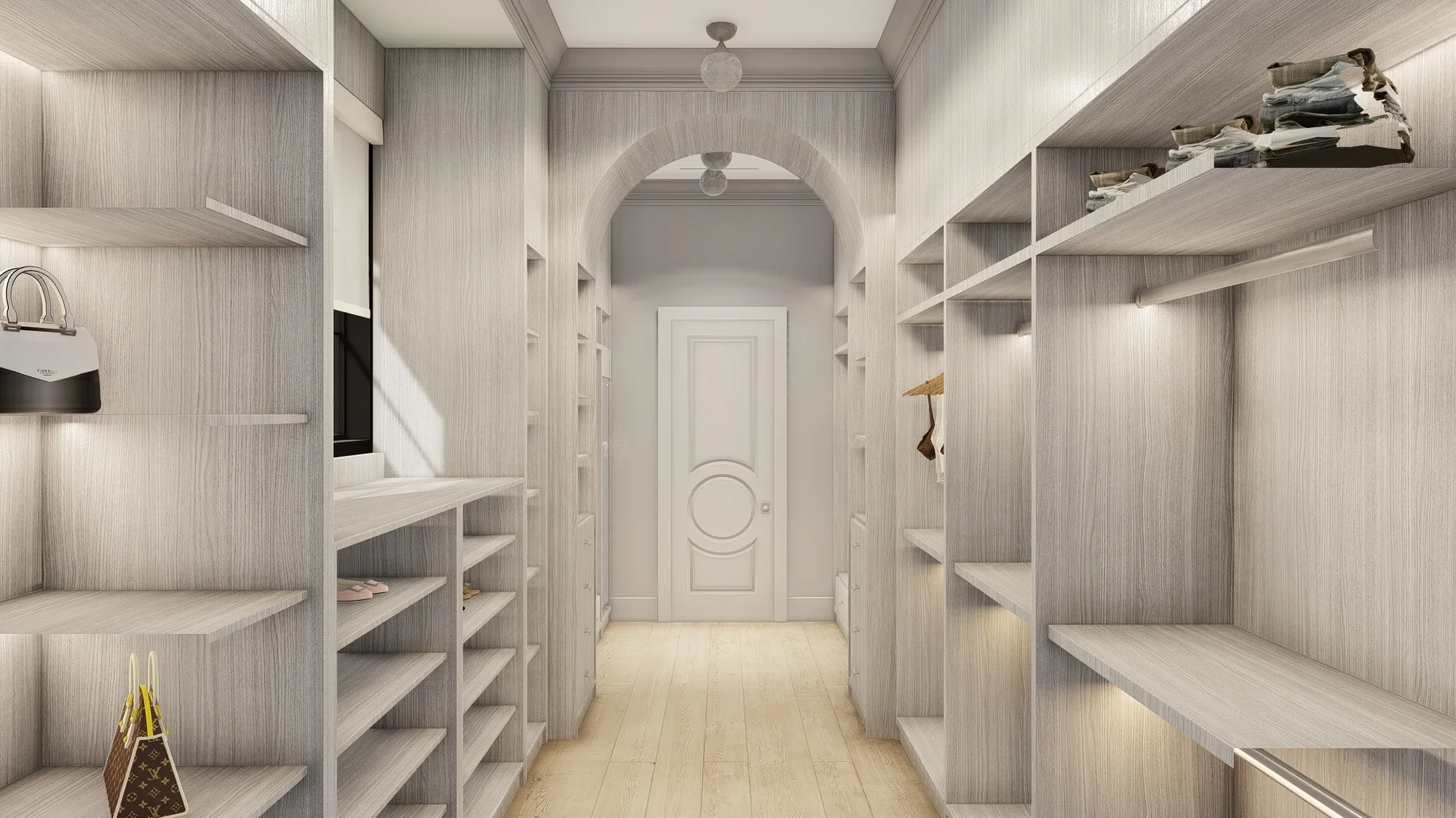 A spacious walk-in closet with white wood shelves and a doorway at the end, decorated in a neutral light color scheme.