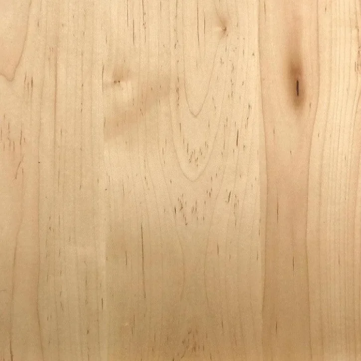 Close-up of a light-colored wooden surface showing natural grain and knots.