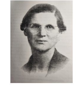 Black and white portrait of a woman with short hair, glasses, and a serious expression.