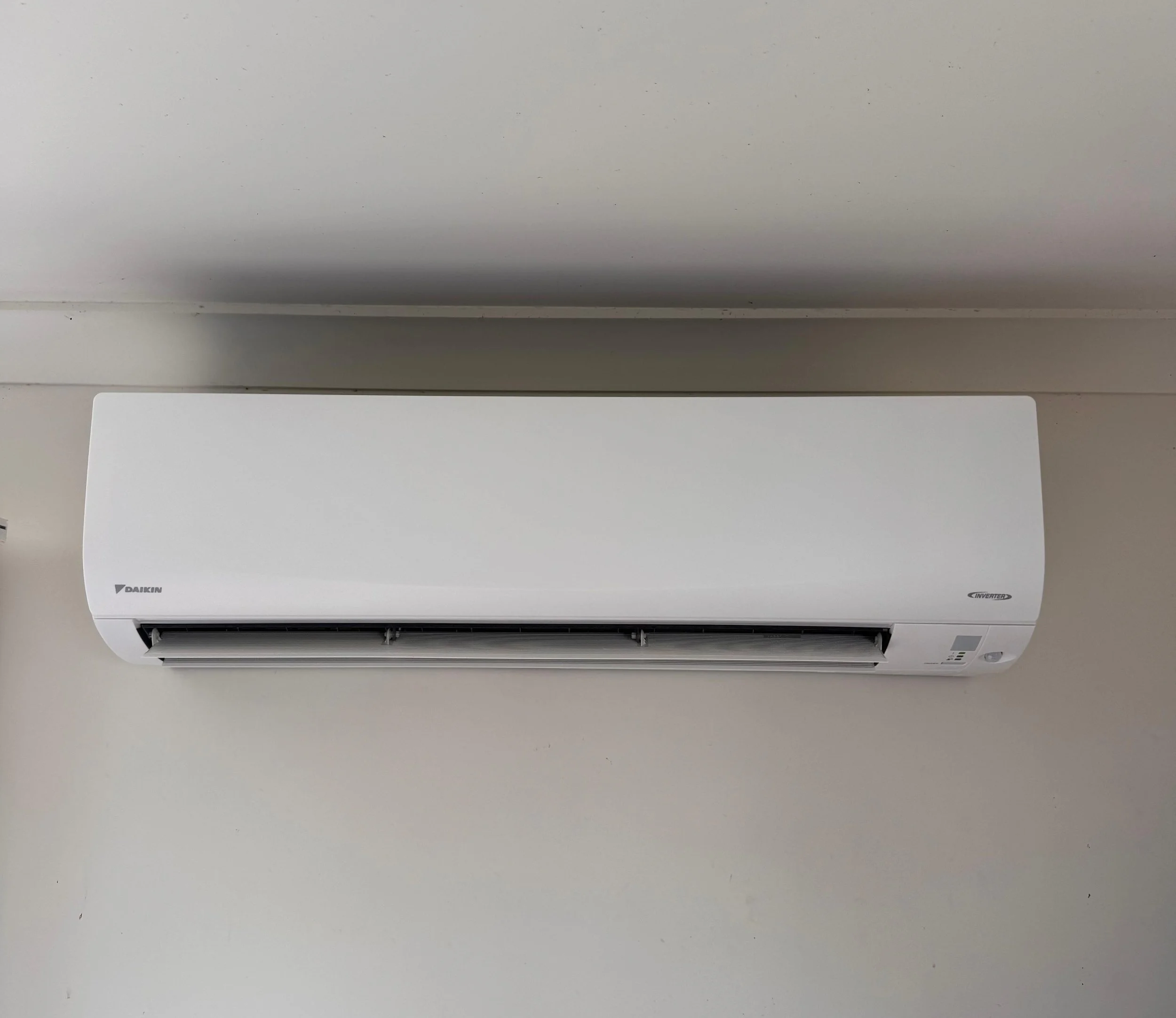 Energy-efficient air conditioning installation in Queensland home living area.
