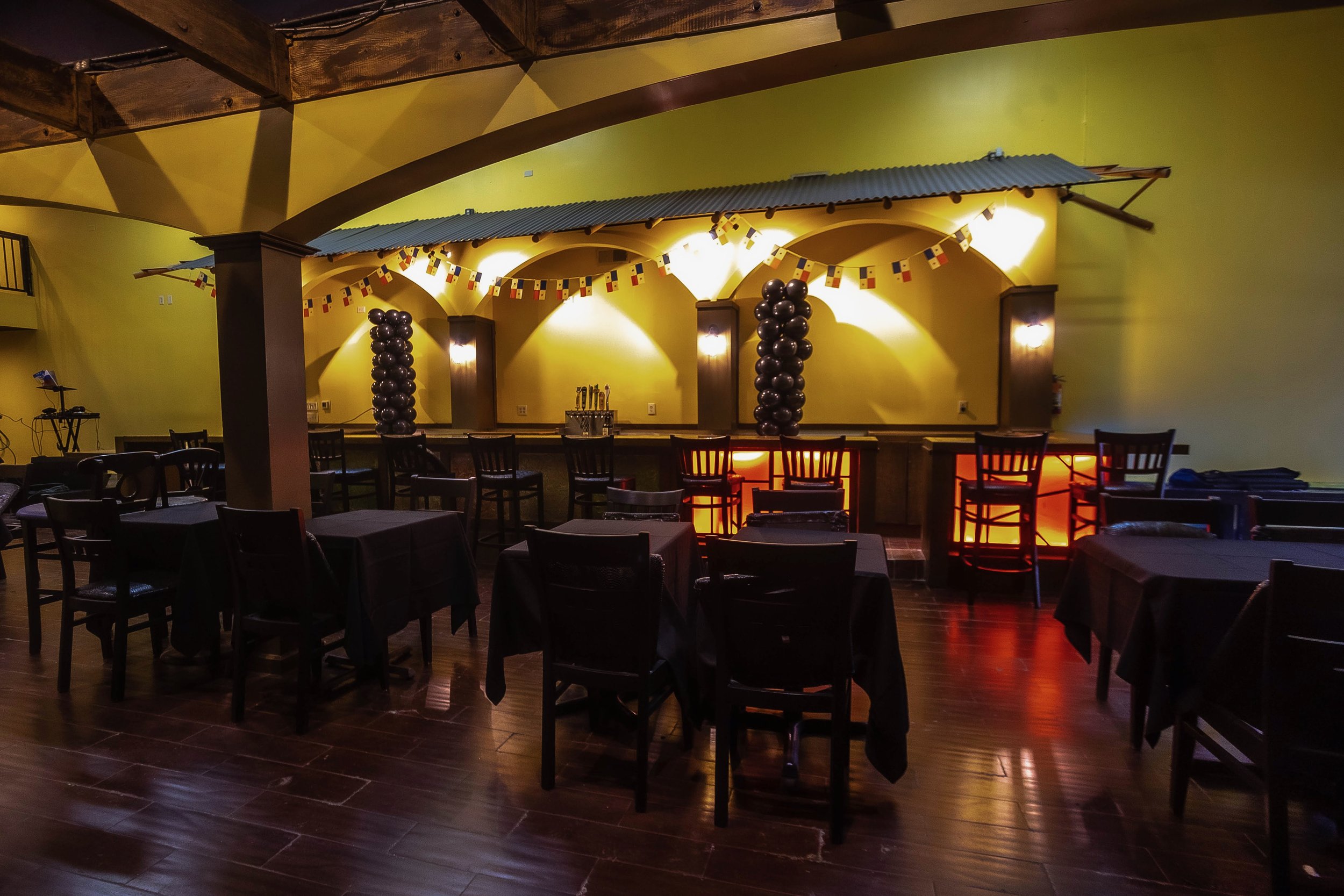 Panama International Restaurant dining room set for private events with arched ceilings and table seating