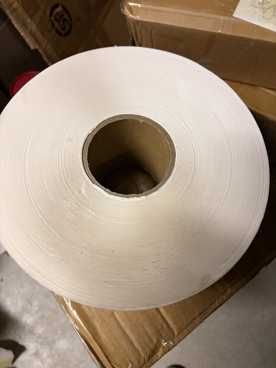 Roll of wine label material checked before custom label production